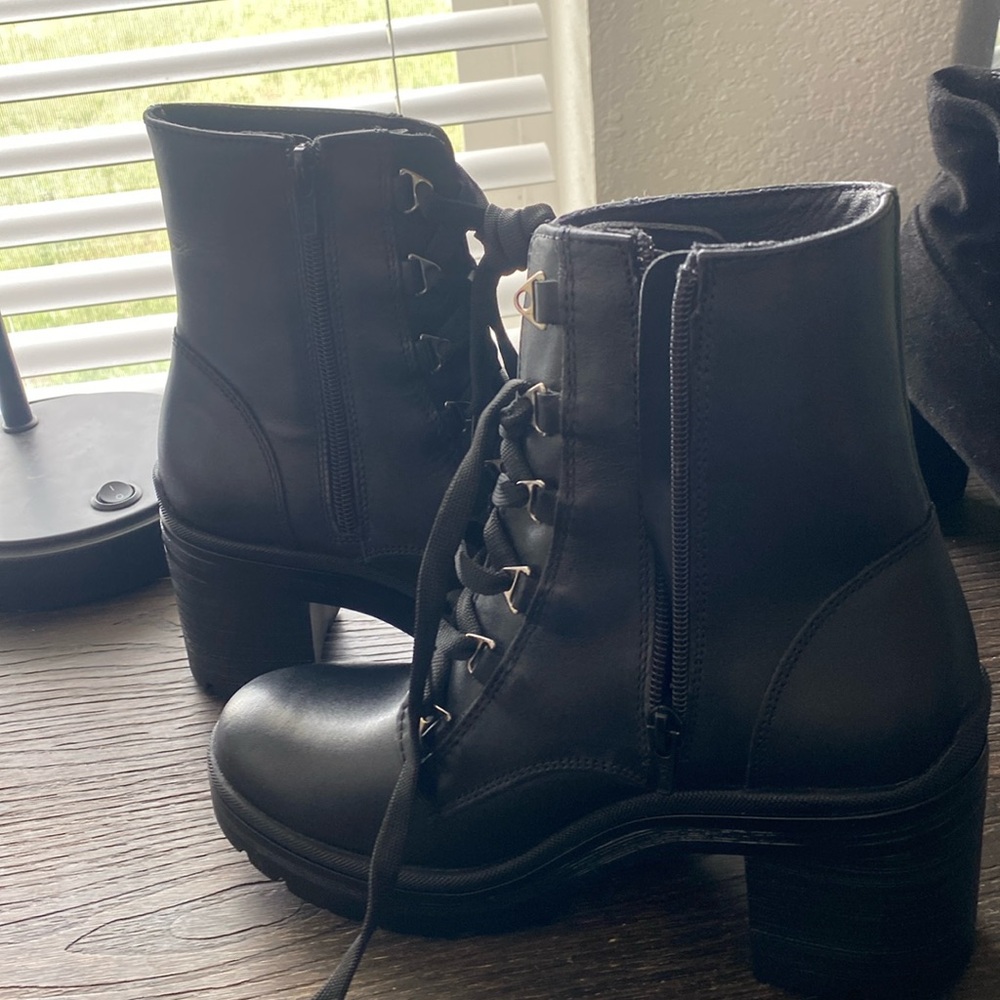 High heel ankle booties. They lace up and zip up as well. Never worn